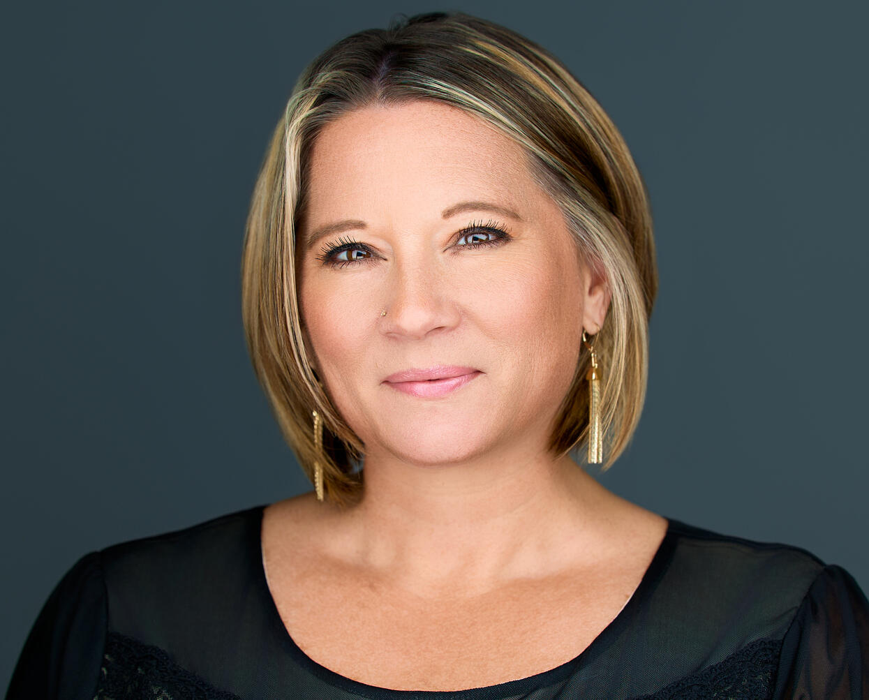 Kris Fores Owner of Kris Flores Insurance Solutions LLC Headshot of Kris Fores Owner of Kris Flores Insurance Solutions LLC, wearing a black top with shoulder length hair of fair blond color.